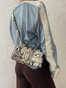 Schwarz/weiß gefleckte Tasche